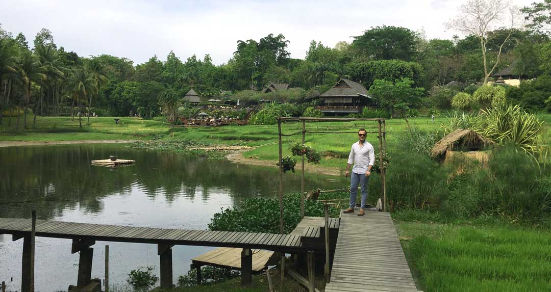 standing among the lake and rice paddies four seasons Chiang Mai